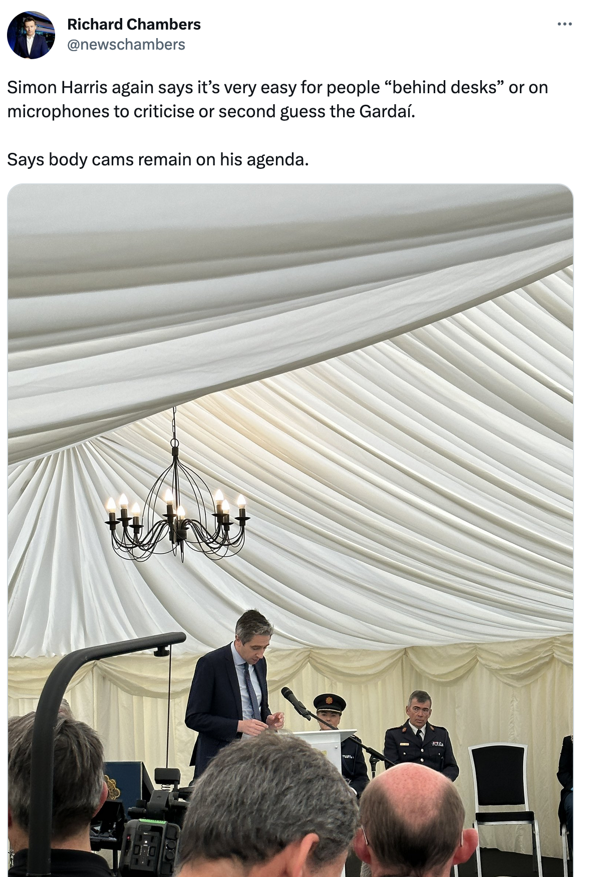 Richard Chambers Tweet from May 22nd 2023, "Simon Harris again says it’s very easy for people “behind desks” or on microphones to criticise or second guess the Gardaí. Says body cams remain on his agenda."