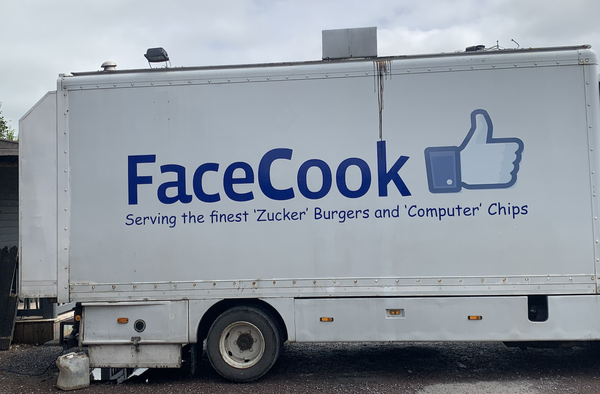 A burger van with FaceCook written on it